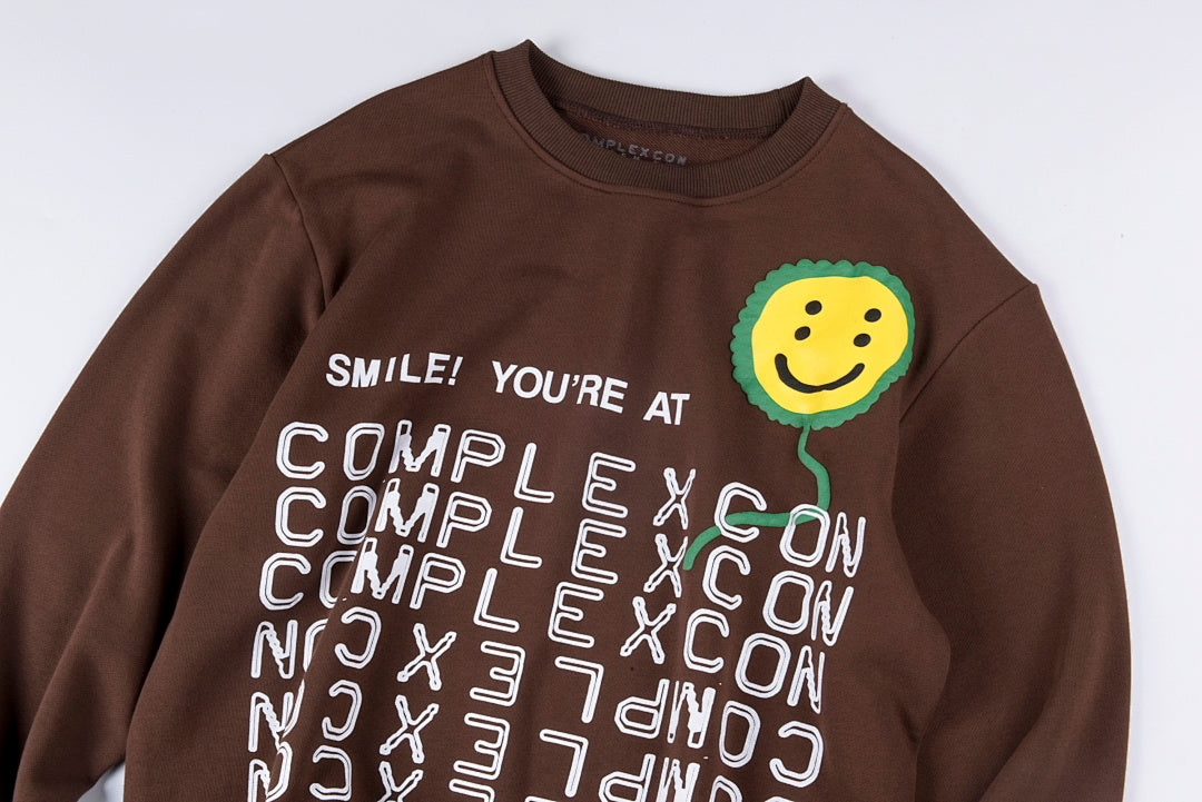 CPFM LA Exhibition Sunflower Smiley Puff Print Crewneck Sweatshirt - Burgundy Brown - product image 8